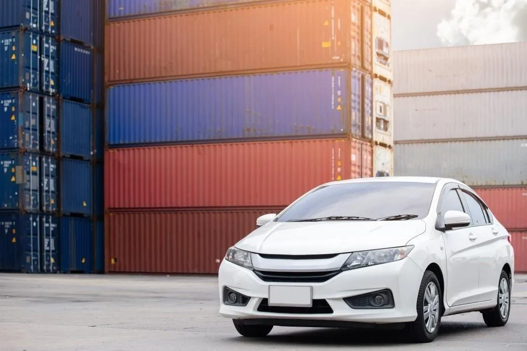 white car parked with container